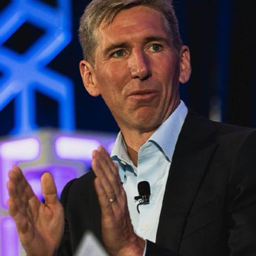 Matt Hougan, Bitwise's CIO, is shown gesturing while speaking at an event, likely during a panel or conference where he discussed his views on Strategy (formerly MicroStrategy) no longer being Bitcoin's largest buyer.
