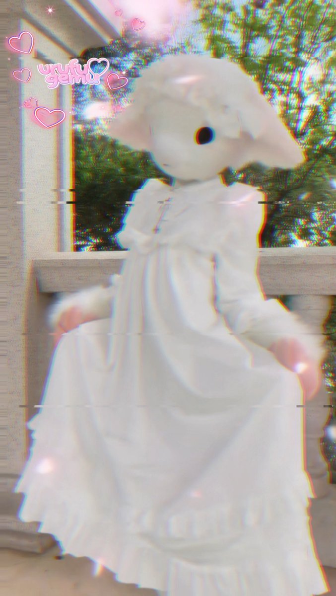 A heavily filtered, dreamy photo of a figure in a white dress with a large white bear-like head/stuffed animal, featuring pink heart stickers and the text 'yufu yemu' in the corner.
