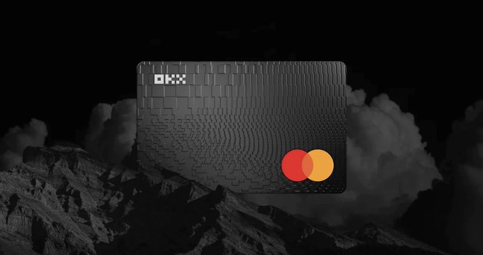 A sleek black OKX Card with a Mastercard logo is displayed against a dramatic mountainous backdrop with clouds, promoting crypto payments with boosted cashback up to €20 and 50% cashback on subscriptions like ChatGPT, Claude, and Netflix.