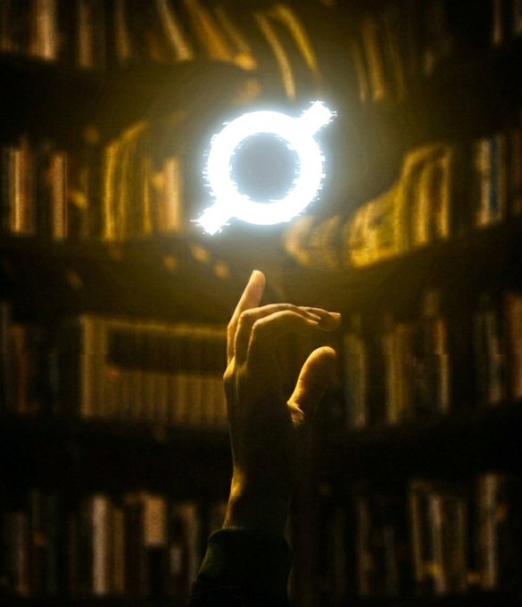 The image features a hand holding up a white symbol, which appears to be a circle or an oval shape with a line through it. This symbol resembles a letter "O", but instead of being a traditional letter, it has been transformed into a glowing light source. The background is filled with bookshelves and numerous books, creating the impression that this scene takes place in a library or a room dedicated to reading and learning.

The image also includes text that reads "ORE is beautiful". This phrase seems to be related to the symbol held up by the hand, as if it were an artistic representation of the letter "O" or a connection between the glowing light source and the word "ore". The combination of these elements creates a visually striking scene that invites viewers to explore its meaning further.