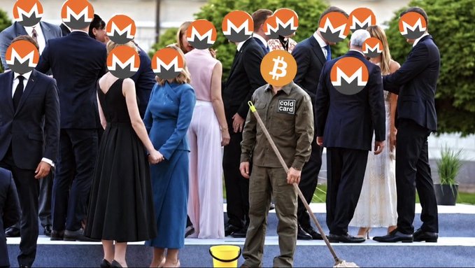 A man in a "cold card" jacket with a mop stands among a crowd of people whose faces are covered with Monero (XMR) logos, humorously depicting Monero's privacy-centric crypto as the "janitor cleaning up" or standing out among mainstream users—ironically positioned as the unseen worker behind the scenes.