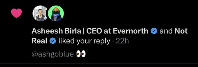 A social media notification showing Asheesh Birla (CEO at Evernorth) and an account called 'Not Real' liked a reply containing '@ashgoblue 👀'.