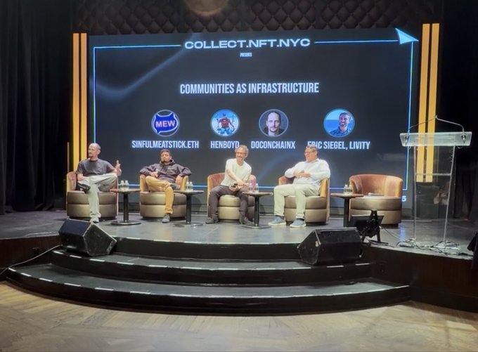 A panel discussion at 'COLLECT.NFT.NYC' titled 'COMMUNITIES AS INFRASTRUCTURE' featuring speakers Sinfulmeatstick.eth, Henb0yd, Doc0nchainx, and Eric Siegel, Livity.