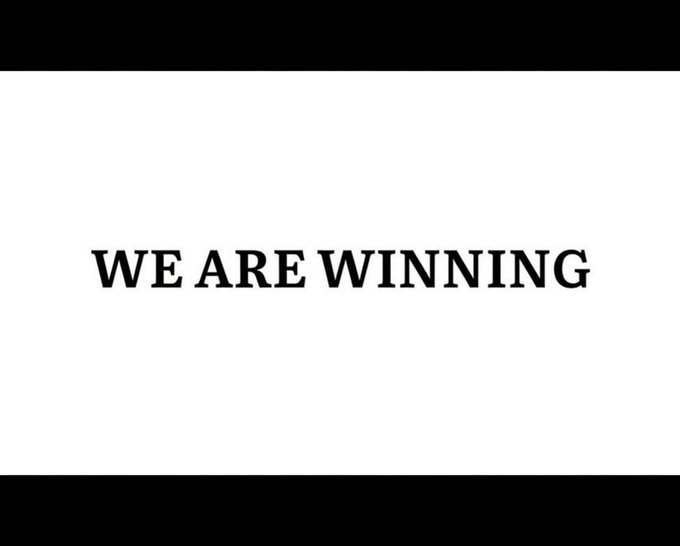 A simple white screen with the bold black text 'WE ARE WINNING' centered in the frame.