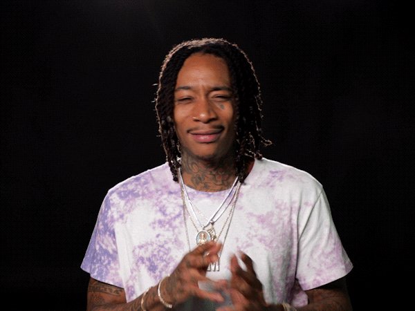 The image features a man with dreadlocks wearing a white t-shirt, smiling at the camera. He has tattoos visible on his neck and wrists. The text "USDC cashback era begins" can be seen in the image, which suggests that there might be an ongoing promotion or special offer related to USDC.