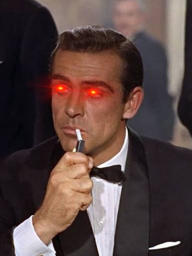 A black-and-white image of Sean Connery as James Bond in a tuxedo smoking a cigarette, with his eyes edited to glow bright red.