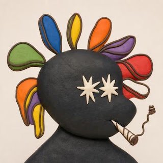 Digital artwork of a dark figure with rainbow-colored petal-shaped protrusions around its head, star-shaped eyes, and a striped cigarette with smoke curling upward.