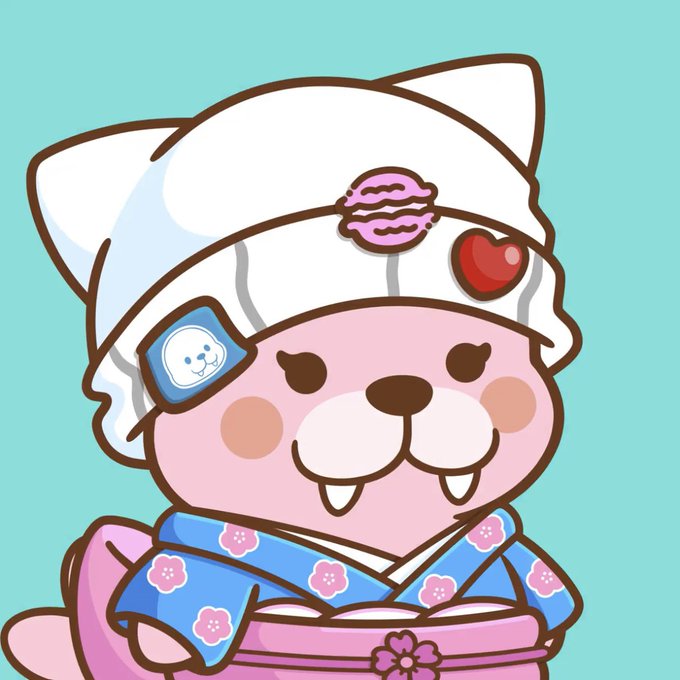 A cute pink cartoon character wearing a white cat-eared hood with pink lips and a red heart decoration, dressed in a blue floral kimono-style garment.