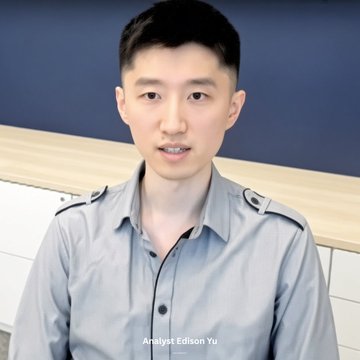 A man wearing a gray button-up shirt is shown in what appears to be a vlog or video recording, with the caption "Analyst Edison Yu" displayed at the bottom of the frame. The image relates to the post by showing the subject who was initially mistaken for being associated with a review about the ticker $SPCX, which Edison Yu had posted.