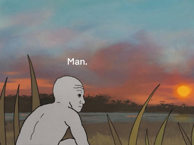 A bald, pale figure crouches in tall grass against a vivid sunset, with the word "Man." written above them in the sky.