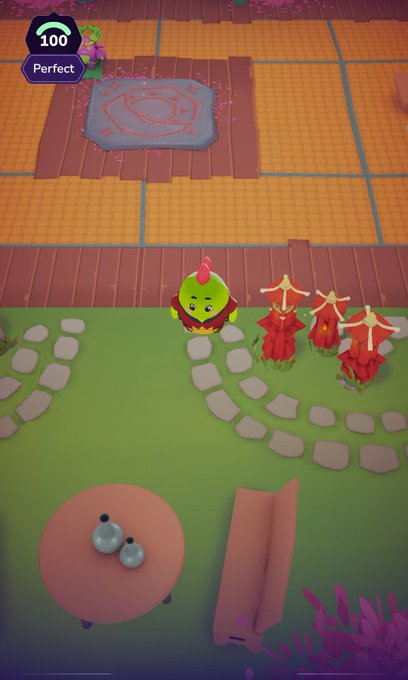 A screenshot from a mobile game showing a green cartoon chicken-like character with a red crest on a grassy path, near a pink cushion with a rune design, with a '100 Perfect' score indicator at the top.