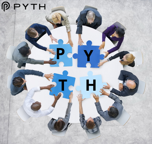 The image shows a group of people sitting around a table with blue puzzle pieces that spell out "PYTH". The individuals are engaged in a collaborative activity, possibly working together or participating in an event related to the word "PYTH". The scene suggests a sense of unity and shared purpose among the participants.