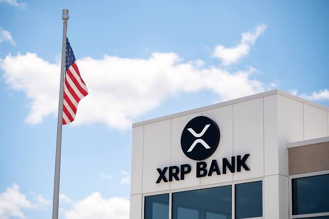 An American flag flies next to a building with the "XRP BANK" logo, symbolizing the legitimacy and capital attraction discussed in the post. The image visually represents the "legitimacy" that the accompanying text claims XRP will attract.