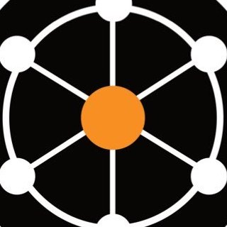A simple black and white circular logo with an orange center, connected by lines to eight white dots arranged in a ring around the perimeter.