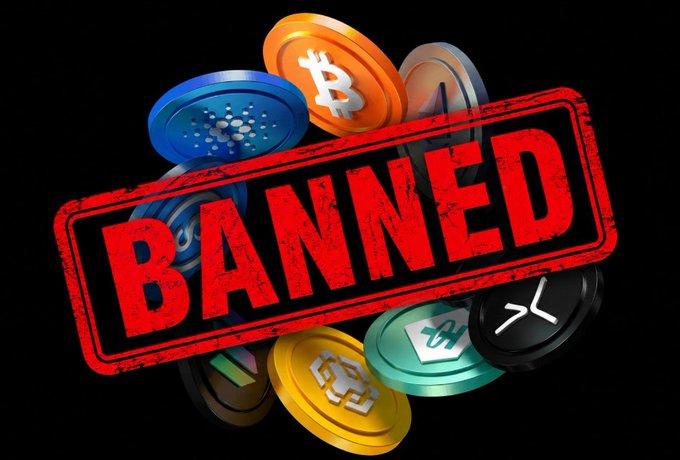A pile of cryptocurrency coins including Bitcoin, Cardano, Ethereum, and XRP with a large red 'BANNED' stamp overlaid on top.