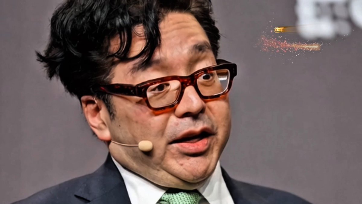 The image features a man wearing glasses and a suit talking into a microphone. He appears to be giving a speech or presentation, possibly related to cryptocurrency or financial matters. In the background, there are two bullet points that read "Tom Lee believes XRP could create new millionaires within the next 90 days" and "focus on what is in the image and how it relates to the post." The man's facial expression suggests he might be discussing a controversial topic or presenting an exciting opportunity for those interested in investing in cryptocurrency.

The text "XRP momentum keeps building and the market is paying attention" implies that there could be significant interest in XRP, possibly due to its potential as a new form of currency or investment. The man's suit and glasses give him a professional appearance, which might suggest he has some authority on the subject matter being discussed.