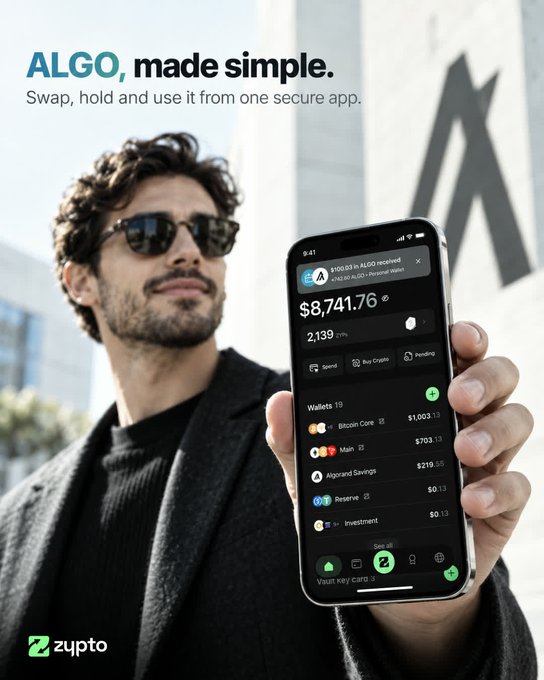 Advertisement for the Zypto app showing a man in sunglasses holding a smartphone displaying a crypto wallet with a balance of $8,741.76 and $100.03 received in ALGO, with the tagline 'ALGO, made simple. Swap, hold and use it from one secure app.'