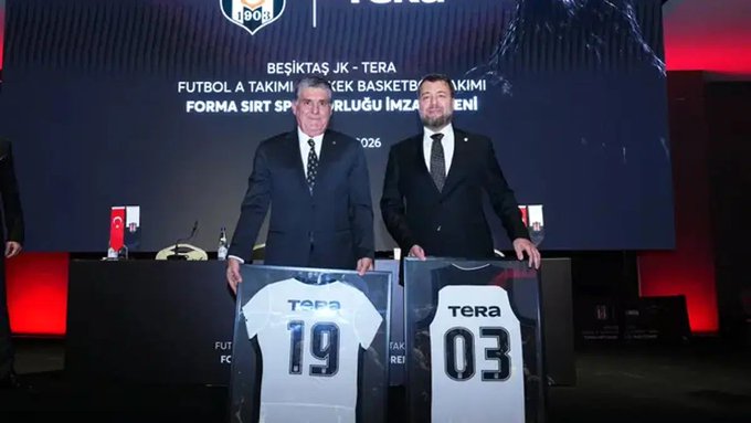 Two men in suits stand at a podium displaying framed Beşiktaş jerseys numbered "19" and "03," both sponsored by "TERA," during what appears to be a sponsorship unveiling ceremony (dated 2026). The image relates to the post by highlighting TERA's role as a jersey sponsor for Beşiktaş JK, the Turkish sports club now reportedly dropping TERA from their squad amid broader financial impacts on the club's shares.