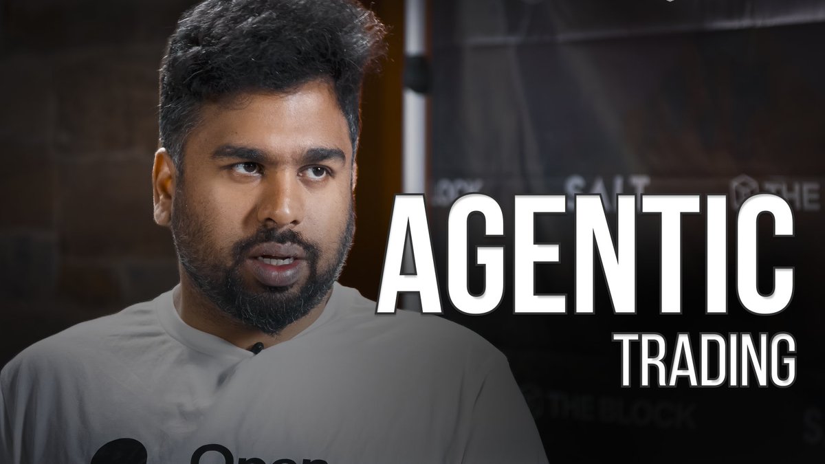 A bearded man in a gray shirt speaking in what appears to be an interview, with the text 'AGENTIC TRADING' displayed prominently beside him.