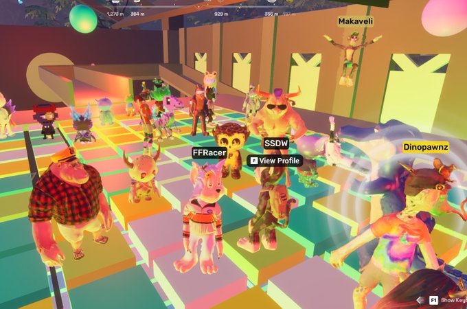 A colorful 3D virtual environment with multiple cartoon avatars (including usernames Makaveli, FFRacer, SSDW, and Dinopawnz) standing on elevated platforms.