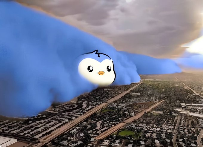 A giant blue cloud formation shaped like a Pudgy Penguin's face looms over a sprawling cityscape, symbolizing the brand's expansive reach and ambitious presence. The image humorously visualizes the Pudgy Penguins team as a massive, all-encompassing force dominating the horizon, reflecting their stated achievements halfway through 2026.