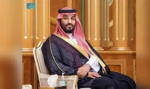 The image features a man wearing traditional Middle Eastern clothing, including a headscarf or turban, sitting in a chair with his hands folded in front of him. The caption below the photo reads "Did you know that $XRP is huge in Saudi Arabia?". This statement suggests that the value of Bitcoin, which is often used as an example for currency comparison, is significant in Saudi Arabia and could be relevant to the image's context.