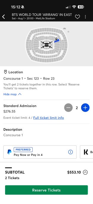 A screenshot from a ticketing app shows 2 tickets to BTS World Tour 'Arirang' in East at MetLife Stadium on August 1, 2020, in Section 123, Row 23, Concourse 1, priced at $553.10 total. The caption highlights how this current price is significantly cheaper than what the user paid during presale, expressing frustration over the price difference.