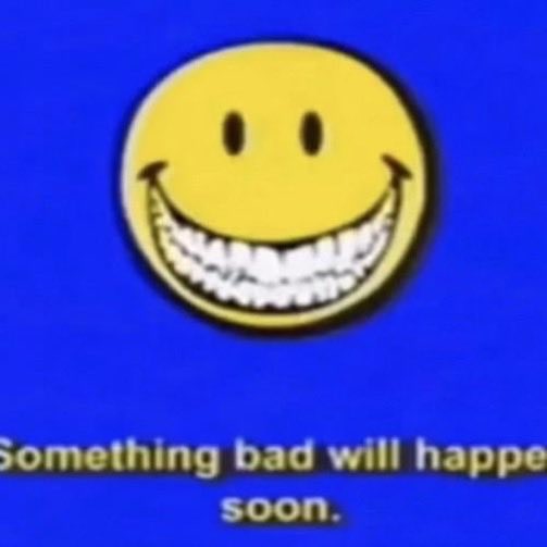 A meme image featuring a yellow smiley face with a wide creepy grin against a blue background, with the text 'Something bad will happen soon.'