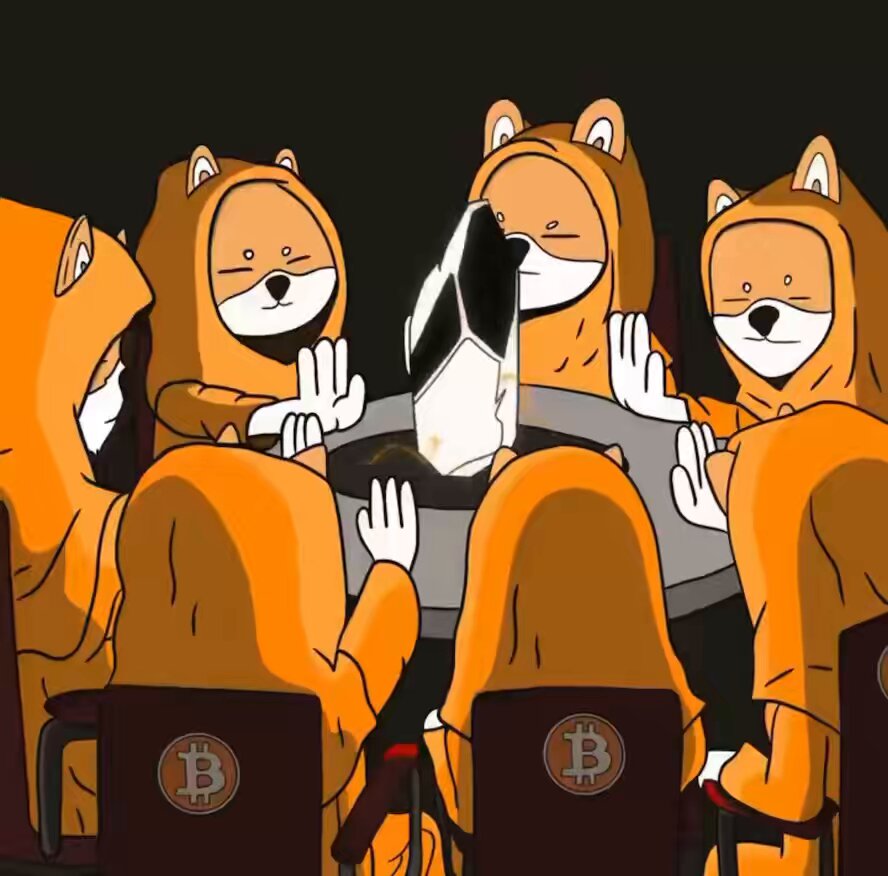 The image features a group of people dressed in orange hooded robes, sitting around a table with laptops open in front of them. The laptops are adorned with Bitcoin logos, indicating that they might be discussing or working on cryptocurrency-related projects. The scene is set against a black background and includes chairs placed around the table where the individuals are seated.