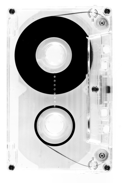 A transparent audio cassette tape with two spools, one wound with magnetic tape and the other empty, is shown against a white background.