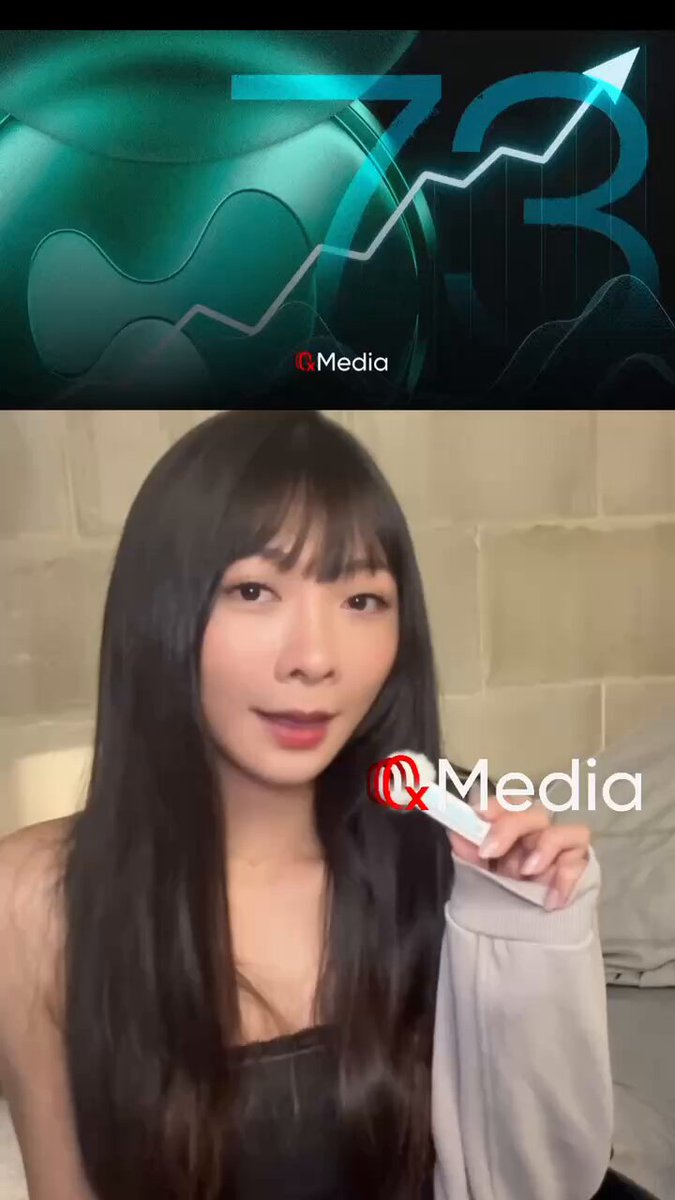 This image depicts a woman holding a remote control that appears to be connected to a television or gaming console. The remote control is pointed at an advertisement for the Hyper Liquid Chain, which seems to be related to a video game or streaming platform. The advertisement features animated graphics of chains attacking a structure symbolizing the cryptocurrency's decline in value, with numbers and arrows representing the market trends. The woman holding the remote appears to be watching the advertisement or possibly playing a game based on its content.