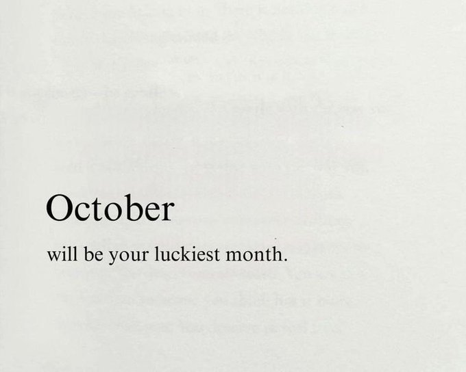 A minimalist image with a white textured background and black text reading 'October will be your luckiest month.'