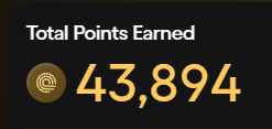 A digital display showing 'Total Points Earned' with the number 453894 in large yellow font alongside a circular emblem on the left.