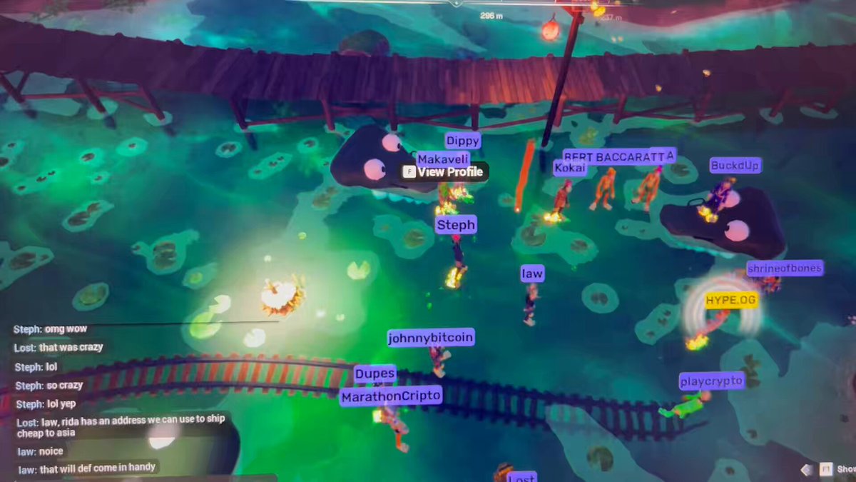 The image shows a screenshot of a video game map, which appears to be a multiplayer game like Minecraft or Fortnite. The map features various locations such as a bridge, train tracks, and a river with fish swimming around. There are also several players in the scene, some of whom have tagged each other on social media platforms. One player has tagged another player named @morethenhype, while another player is tagged by @OthersideMeta. The map also includes a description that reads "Mutant Mocktails with @morethenhype and the fam in @OthersideMeta was wild tonight."