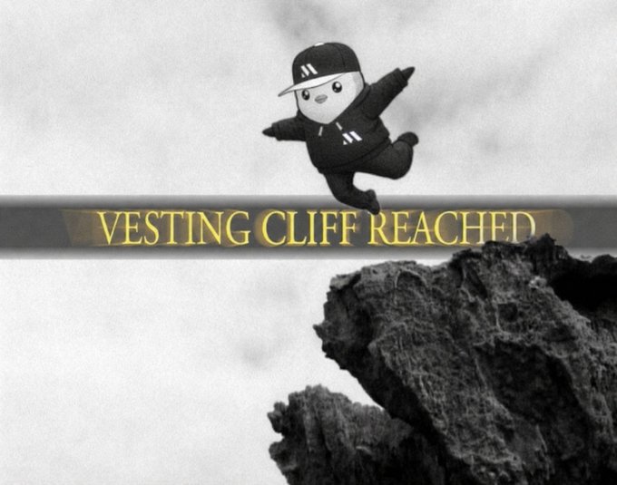 Meme image of a small cartoon character jumping off a cliff with the text 'VESTING CLIFF REACHED'.