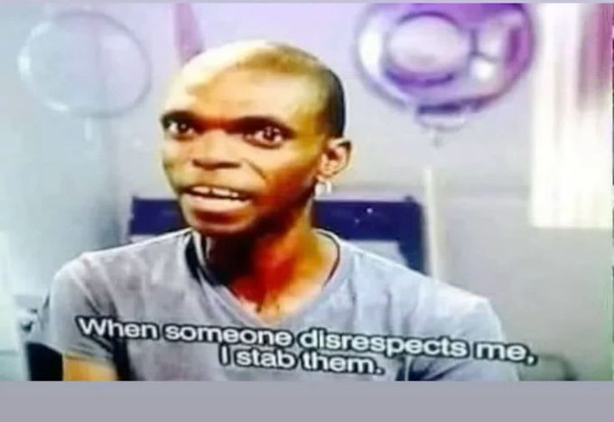 The image features a man wearing a gray t-shirt, sitting down and looking at something off camera. The caption of the image reads "When someone disders me, I stab them." This phrase seems to be related to the content of the image or the context in which it was taken.