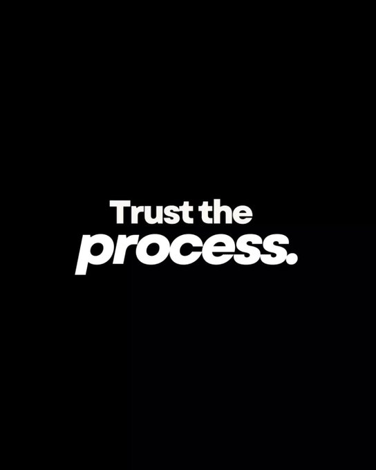 A minimalist black graphic with bold white text reading 'Trust the process.'