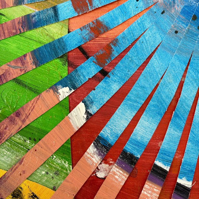A vibrant abstract artwork featuring radiating lines and fan-like shapes in bright shades of blue, green, orange, and red.