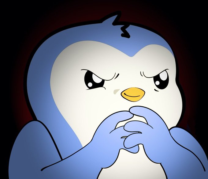 A cartoon image of a blue and white penguin-like character with a serious, focused expression, holding its hands clasped together against a dark background.