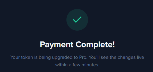 A dark confirmation screen displays a green checkmark with the text "Payment Complete!" and a message stating "Your token is being upgraded to Pro. You'll see the changes live within a few minutes." The image relates to the post by visually indicating a successful payment/listing that is helping drive the $TUZKI token upward.