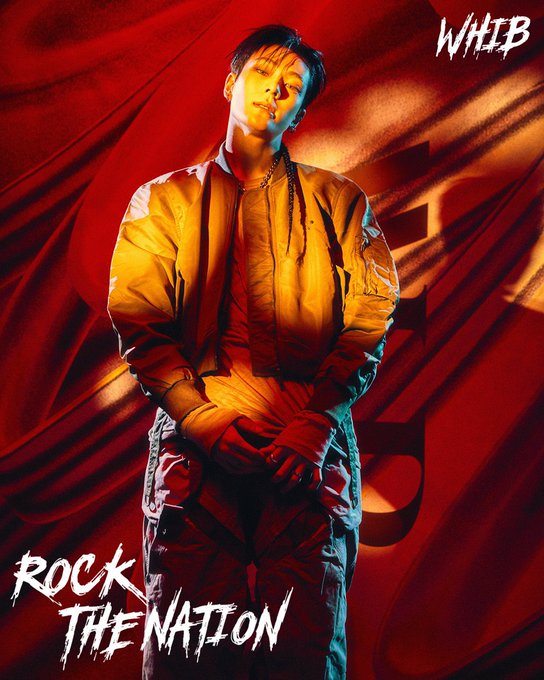 This image features a man posing in a yellow jacket with the text "WHIB" and "ROCK THE NATION" prominently displayed, resonating with the post's mention of "Rock the Nation" and a call to "HODL until tomorrow."