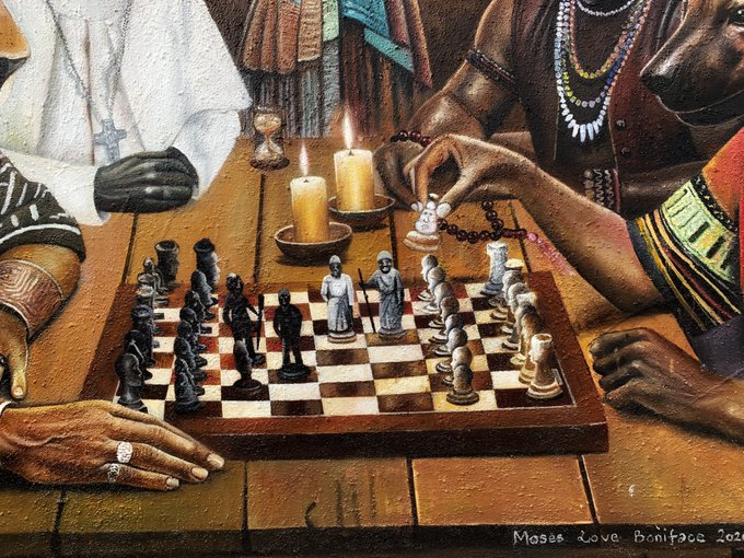 A detailed painting by Moses Love Boniface (2022) depicting two figures engaged in a candlelit chess game, with one hand adorned with rings and another holding a rosary, while the text "Moses Love Boniface 2022" appears in the bottom right corner. The striking visual of people playing chess with carved figurines complements the post's metaphor about being a pawn in life's game, available as an NFT on Transient Labs.