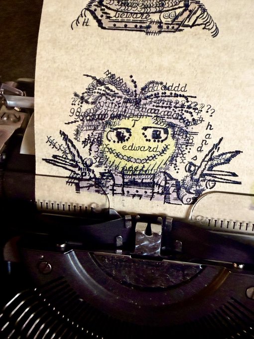 An artistic typewriter art piece on paper features the name 'edward' surrounded by repeated characters, numbers, and symbols with the word 'beware' at the top.