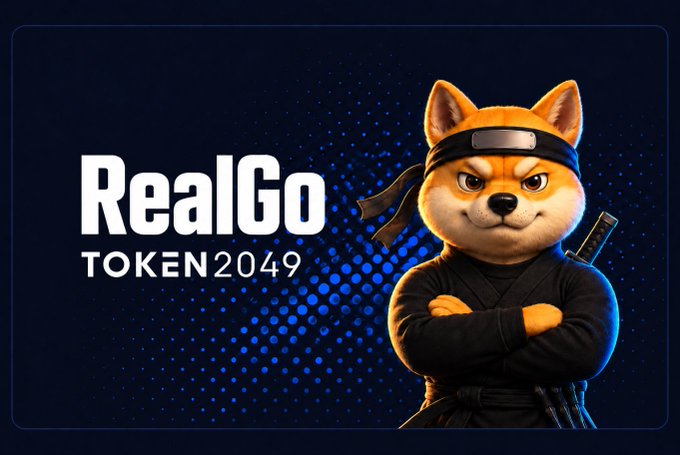 A ninja dog mascot in black garb stands alongside the "RealGo TOKEN2049" branding on a blue dotted background, visually announcing RealGo's presence and upcoming reveal at the TOKEN2049 conference.