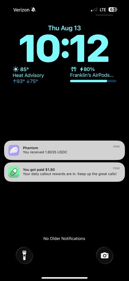 An iPhone lock screen on Verizon showing the time 10:12 on Thu Aug 13, with a Heat Advisory for 85°, an AirPods battery notification, and two notifications: a Phantom crypto notification showing receipt of 1.8035 USDC, and a daily callout reward of $1.80.
