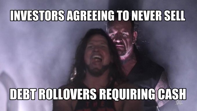 A meme uses a scene from a movie showing a laughing man being grabbed from behind, with text reading 'INVESTORS AGREEING TO NEVER SELL' at the top and 'DEBT ROLLOVERS REQUIRING CASH' at the bottom.