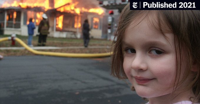 A close-up of a young girl with a slight smile in the foreground, while a house burns in the background with firefighters and a fire hose visible, marked 'Published 2021' with a New York Times logo.
