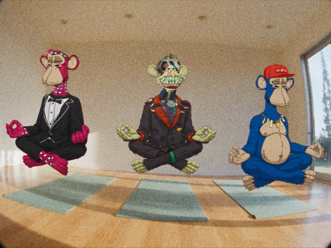 Three anthropomorphic Bored Ape NFT characters are depicted levitating in a meditation pose on yoga mats atop a table.