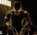 A dark, stylized image shows a muscular person seated in shadow, lit from behind so their face is not visible.