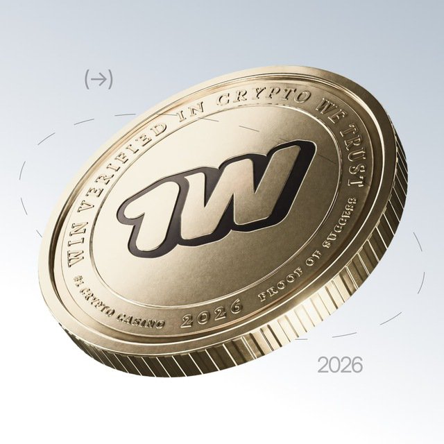 A gold commemorative coin featuring the "$1WIN" logo with text reading "WIN VERIFIED IN CRYPTO WE TRUST," "2026," and "BLOCKCHAIN SUCCESS" along its edge, visually symbolizing the project's crypto token. The coin's polished design and "2026" date reinforce the post's message about the upcoming official announcement regarding $1WIN's dual-native deployment on BNB Chain and Solana.